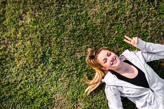 Top view of a young woman on the ground