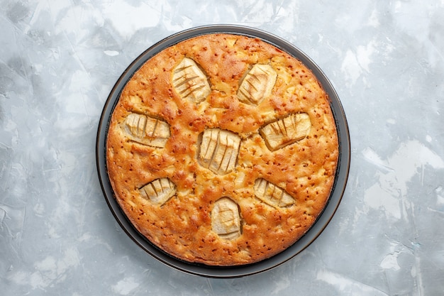 Top view yummy apple pie sweet baked inside pan on the white desk