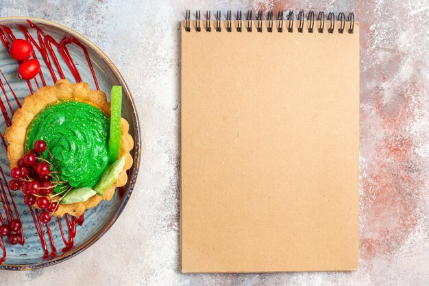 Top view yummy creamy cake with fruits on light table biscuit dessert sweets cake