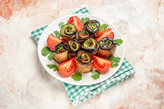 top view yummy eggplant rolls with tomatoes and greens