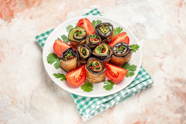 top view yummy eggplant rolls with tomatoes and greens