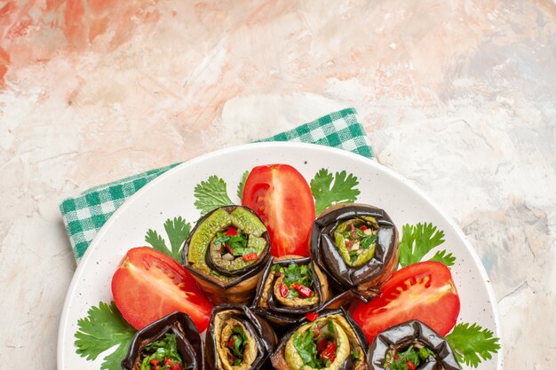 top view yummy eggplant rolls with tomatoes and greens