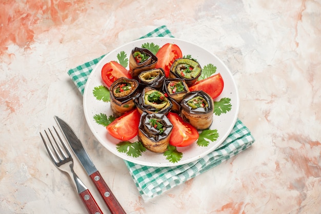 top view yummy eggplant rolls with tomatoes and greens