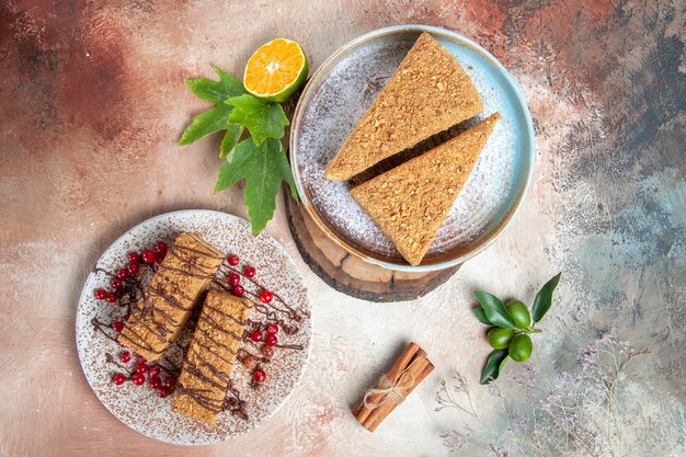 Top view yummy honey cake different slices on light