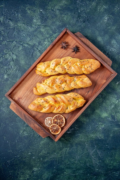 Free photo top view yummy pastries on a dark-blue background dough pie cake oven tea sweet hotcake bake color