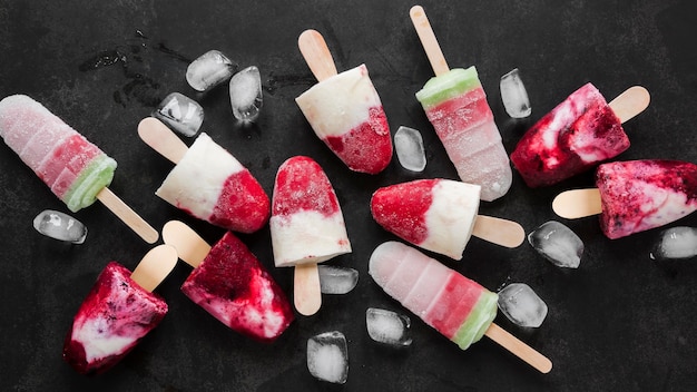 Top view of yummy popsicles with ice