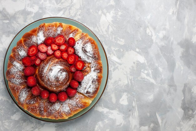 Top view yummy strawberry pie with sugar powder on white desk