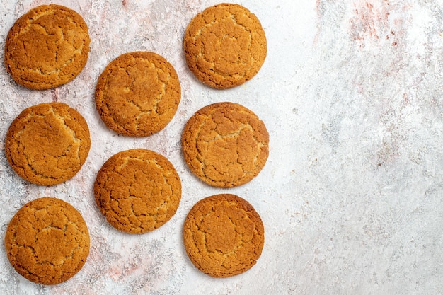 Top view of yummy sugar cookies on white surface