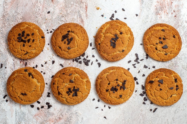 Top view of yummy sugar cookies on white surface