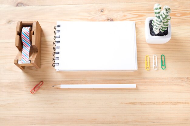 Topview of office stuff on wooden working table.