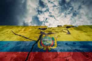 Free photo torn and broken flag of ecuador on cement wall