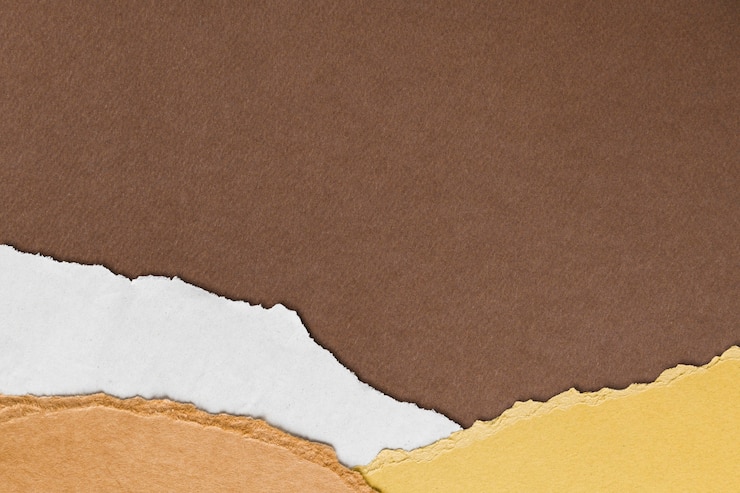 Free Photo torn brown paper border on handmade earth tone background