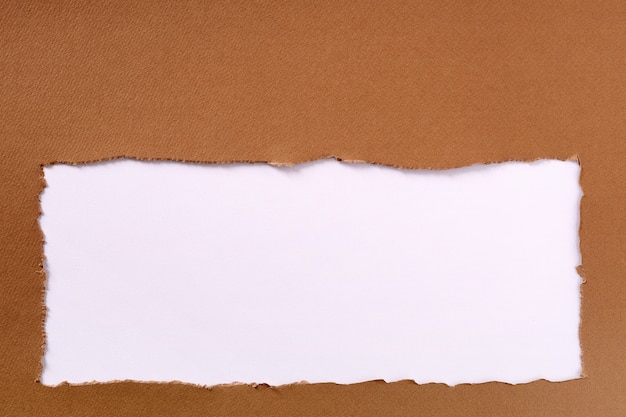 Torn brown paper frame white background