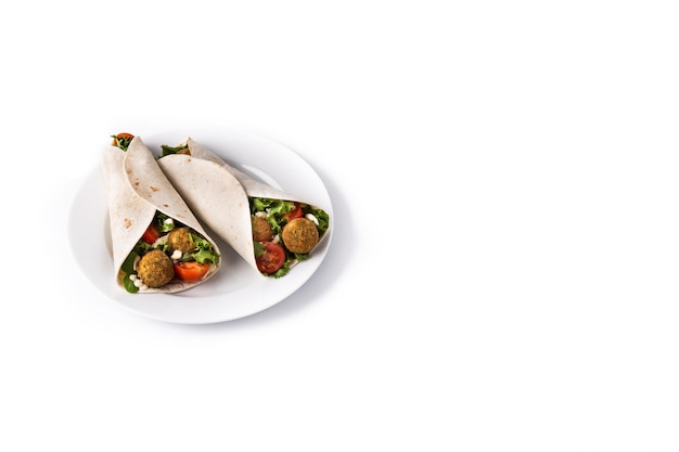 Tortilla wrap with falafel and vegetables isolated on white background