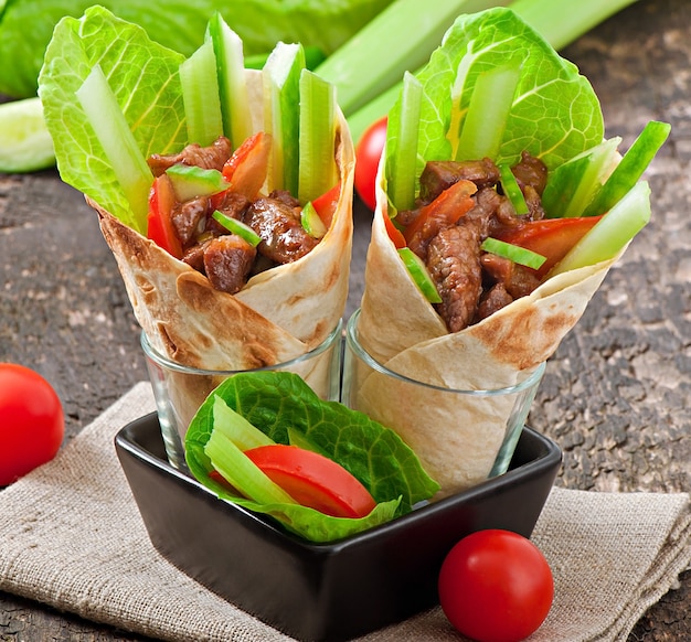 Tortilla wraps with meat and fresh vegetables