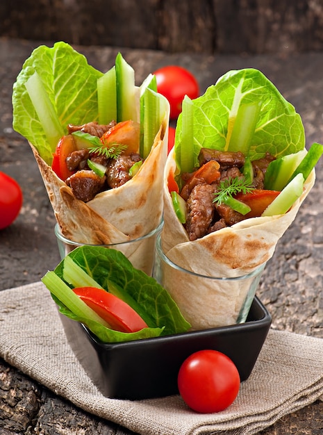 Tortilla wraps with meat and fresh vegetables