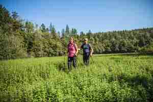 Free photo tourist couple on a dirt path at a nature park in rakov skocjan, slovenia