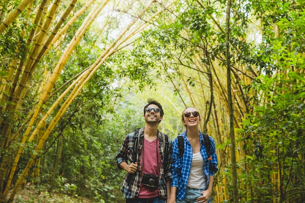 Tourist couple having fun in forest