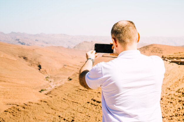 Tourist in desert landscape