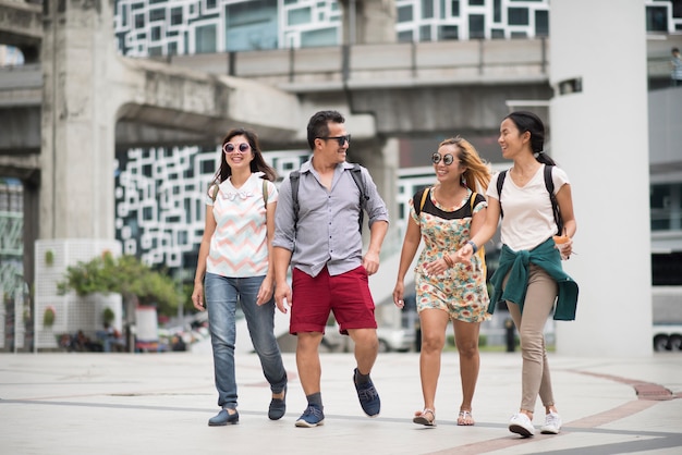 Tourist group friendship walking travel in the city