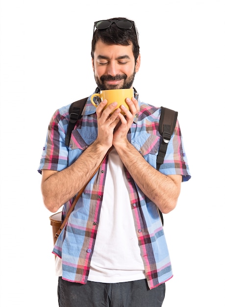 Tourist holding a cup of coffee