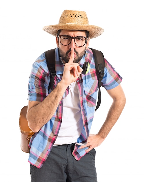 Tourist making silence gesture