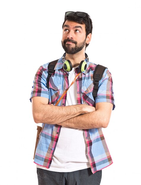 Tourist thinking over white background