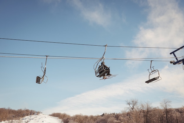 Free photo tourist travelling in ski lift