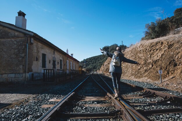 Tourist walking on railway