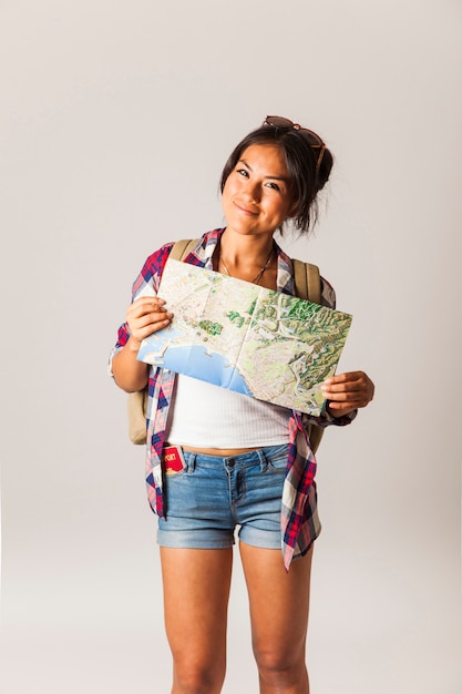 Tourist woman holding map