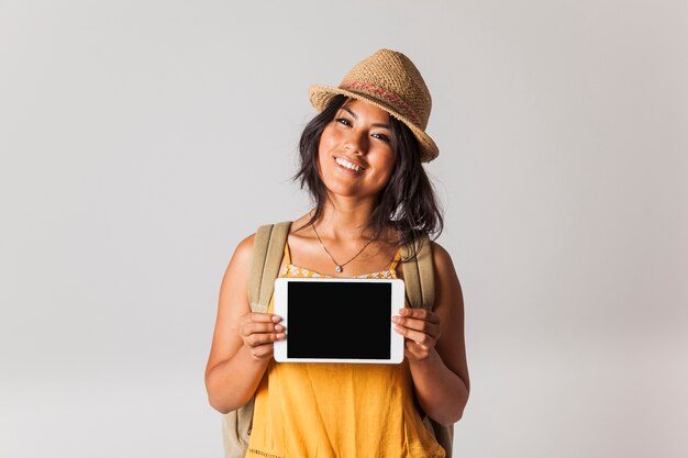 Tourist woman holding tablet