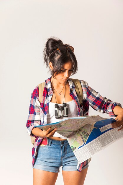 Tourist woman looking at map