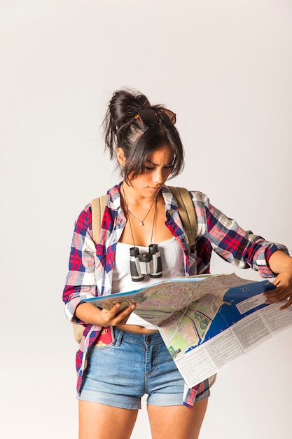 Tourist woman looking at map