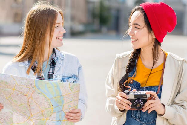 Touristic women with map