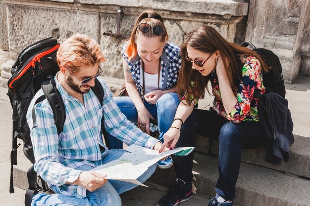 Tourists in city looking at map