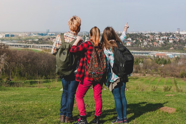 Tourists on hill looking at city