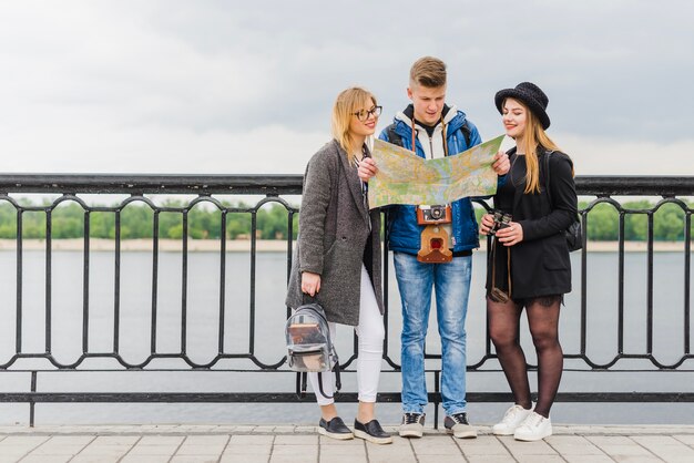 Tourists standing on waterfront