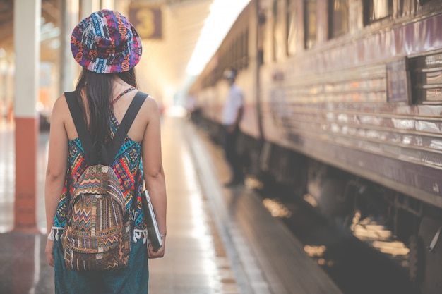 Tourists travel to the train station.