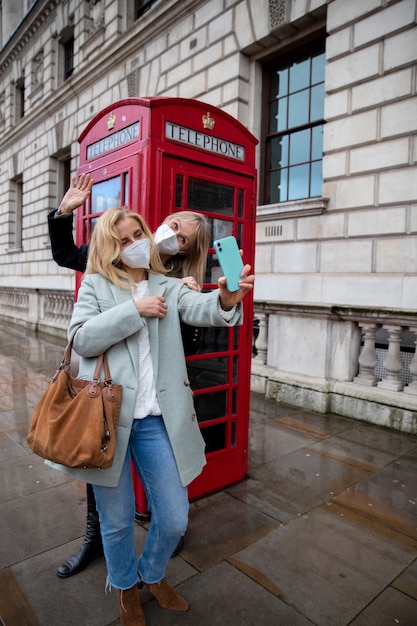 Tourists visiting city and wearing travel mask