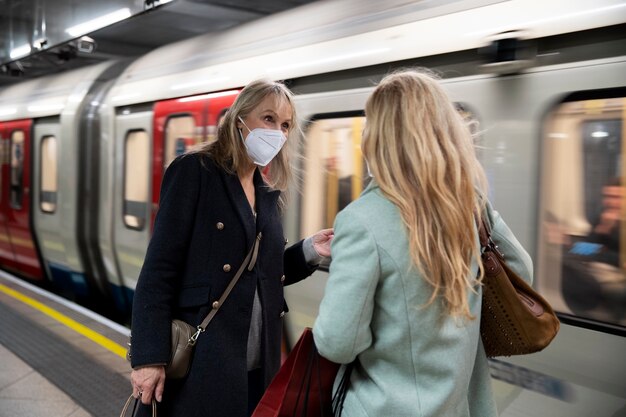 Tourists visiting city and wearing travel mask