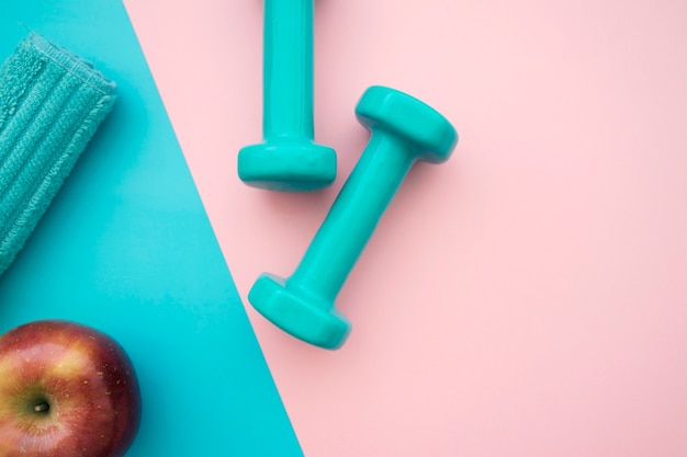 Towel, apple and dumbbells