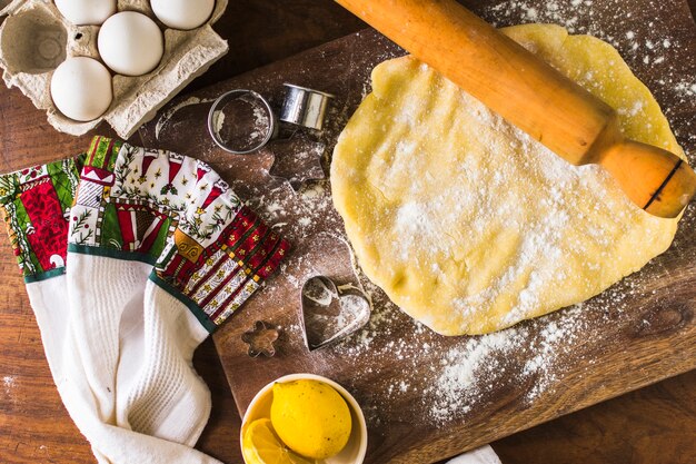 Towel near dough and utensils