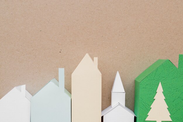 Town made with different type of paper on brown backdrop