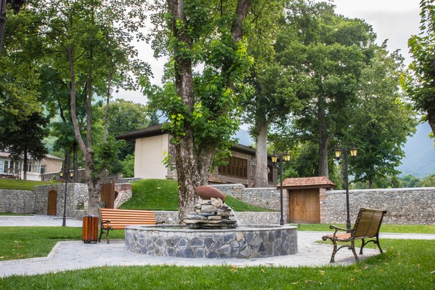 Town park with benches and fireplace.