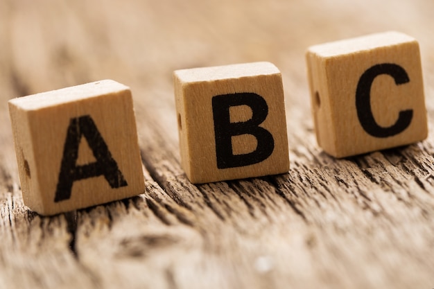 Toy bricks on the table with ABC letters