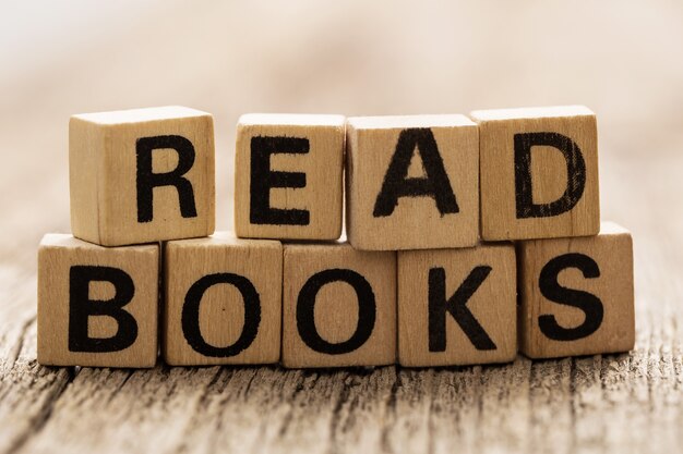 Toy bricks on the table with READ BOOKS words