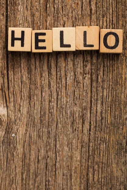 Toy bricks on the table with word hello