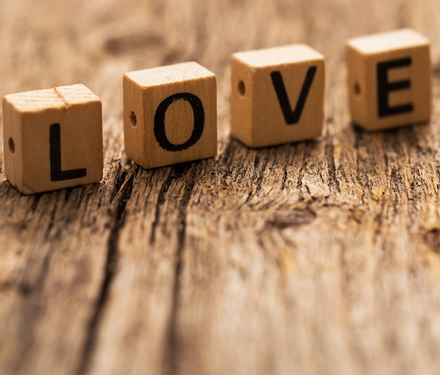 Toy bricks on the table with word LOVE