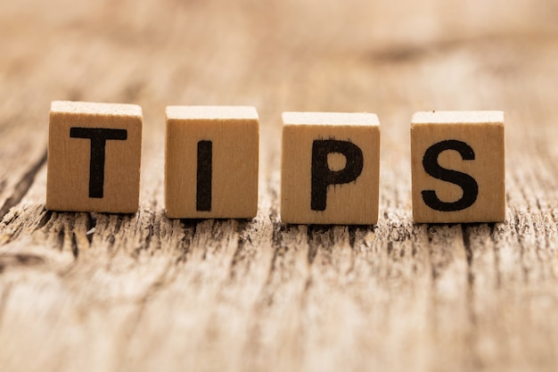 Toy bricks on the table with word TIPS