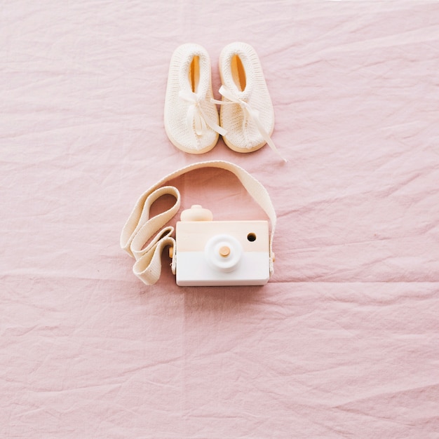 Toy camera and baby-shoes